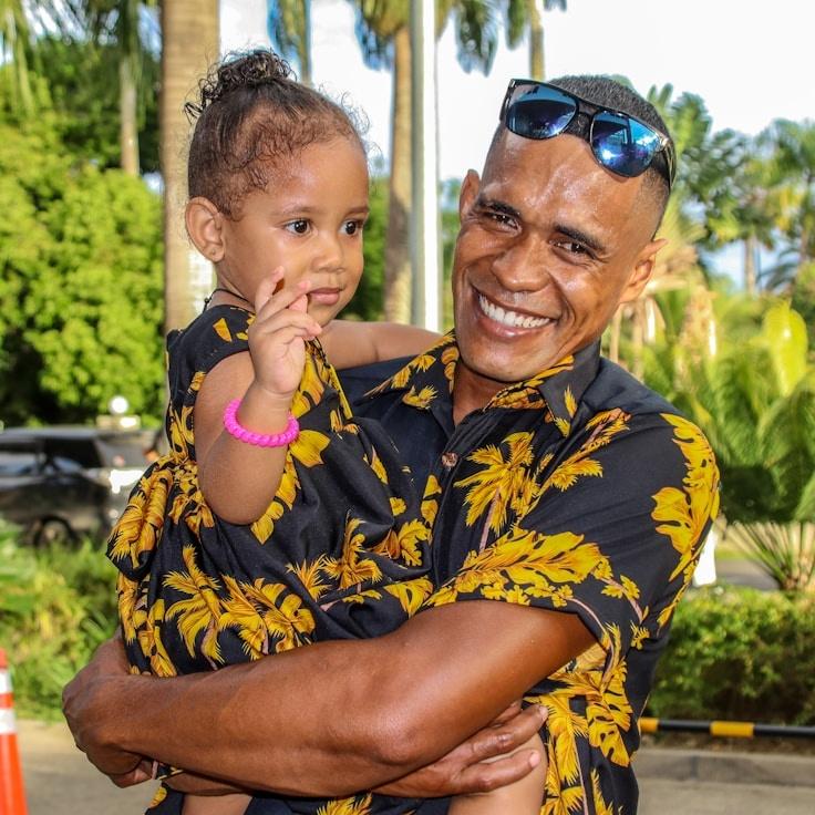Aisha Rao, Lead Design Curator at Global Data Network, reviewing corporate floral arrangements